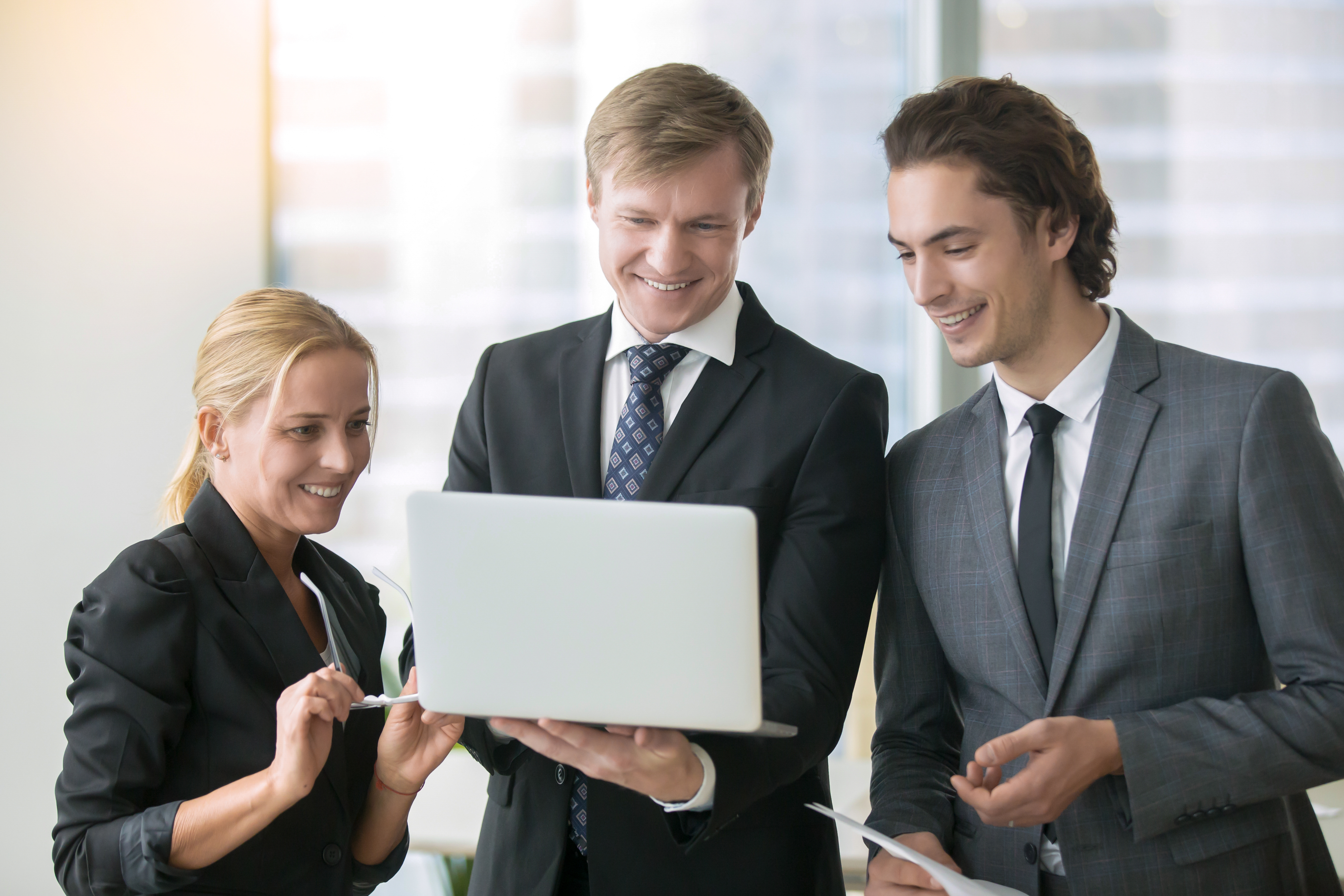 AssureSol Services team in office